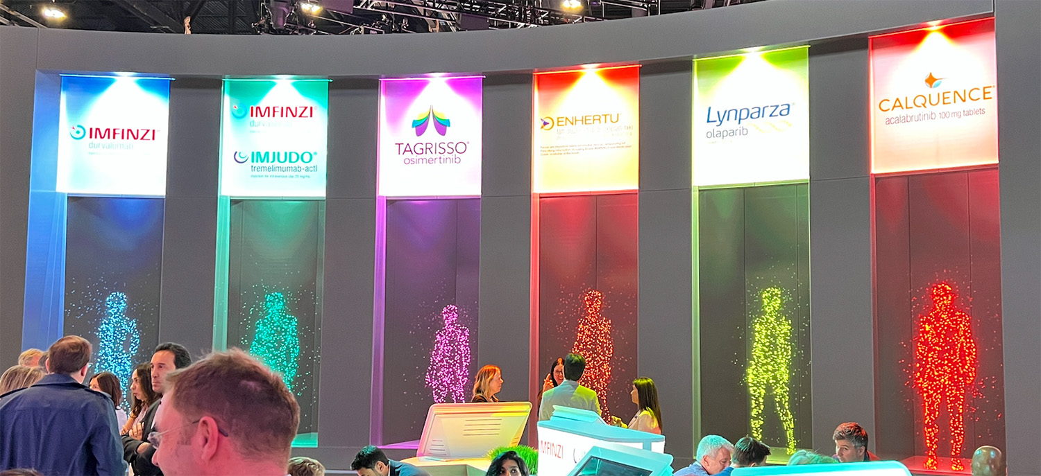 AstraZeneca’s ASCO 2023 display, featured 3D images of figures resembling a human body made of tiny dots for each of their brands. Each brand's figure was a different color, which matched the color of the brand.